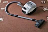 A steam cleaning device is used to rid the carpet fibers of mites. 